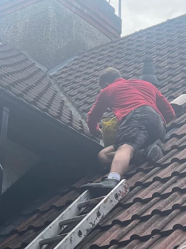 A1 Roofing team working on a residential property